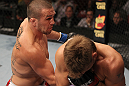 SUNRISE, FL - JUNE 08:   (L-R) Josh Neer punches Mike Pyle in a Welterweight bout during the UFC on FX 3 event at Bank Atlantic Center on June 8, 2012 in Sunrise, Florida.  (Photo by Josh Hedges/Zuffa LLC/Zuffa LLC via Getty Images)