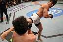 SUNRISE, FL - JUNE 08:   (R-L) Erick Silva kicks Charlie Brenneman in a Welterweight bout during the UFC on FX 3 event at Bank Atlantic Center on June 8, 2012 in Sunrise, Florida.  (Photo by Josh Hedges/Zuffa LLC/Zuffa LLC via Getty Images)