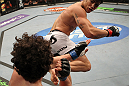 SUNRISE, FL - JUNE 08:   (R-L) Erick Silva kicks Charlie Brenneman in a Welterweight bout during the UFC on FX 3 event at Bank Atlantic Center on June 8, 2012 in Sunrise, Florida.  (Photo by Josh Hedges/Zuffa LLC/Zuffa LLC via Getty Images)