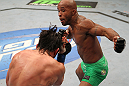 SUNRISE, FL - JUNE 08:   (R-L) Demetrious Johnson punches Ian McCall in a Flyweight bout during the UFC on FX 3 event at Bank Atlantic Center on June 8, 2012 in Sunrise, Florida.  (Photo by Josh Hedges/Zuffa LLC/Zuffa LLC via Getty Images)