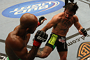 SUNRISE, FL - JUNE 08:   (R-L) Ian McCall kicks Demetrious Johnson in a Flyweight bout during the UFC on FX 3 event at Bank Atlantic Center on June 8, 2012 in Sunrise, Florida.  (Photo by Josh Hedges/Zuffa LLC/Zuffa LLC via Getty Images)