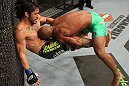 SUNRISE, FL - JUNE 08:   (R-L) Demetrious Johnson takes down Ian McCall in a Flyweight bout during the UFC on FX 3 event at Bank Atlantic Center on June 8, 2012 in Sunrise, Florida.  (Photo by Josh Hedges/Zuffa LLC/Zuffa LLC via Getty Images)