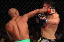 SUNRISE, FL - JUNE 08:   (L-R) Demetrious Johnson punches Ian McCall in a Flyweight bout during the UFC on FX 3 event at Bank Atlantic Center on June 8, 2012 in Sunrise, Florida.  (Photo by Josh Hedges/Zuffa LLC/Zuffa LLC via Getty Images)