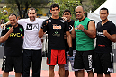 BELO HORIZONTE, BRAZIL - JUNE 20:   Cezar Ferreira (center) poses for a photo with his team during the UFC 147 open workouts at Praca da Estacao on June 20, 2012 in Belo Horizonte, Brazil.  (Photo by Josh Hedges/Zuffa LLC/Zuffa LLC via Getty Images)