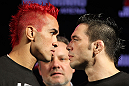 BELO HORIZONTE, BRAZIL - JUNE 21:   (L-R) Opponents Godofredo Pepey and Rony "Jason" Mariano Bezerra face off during the UFC 147 press conference at Ouro Minas Palace on June 21, 2012 in Belo Horizonte, Brazil.  (Photo by Josh Hedges/Zuffa LLC/Zuffa LLC via Getty Images)