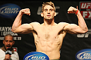 ATLANTIC CITY, NJ - JUNE 21: TJ Waldburger flexes after making weight during the UFC on FX official weigh in at Revel Casino on June 21, 2012 in Atlantic City, New Jersey.  (Photo by Nick Laham/Zuffa LLC/Zuffa LLC via Getty Images)