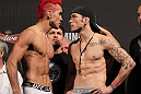 BELO HORIZONTE, BRAZIL - JUNE 22:   (L-R) Opponents Godofredo Pepey and Rony "Jason" Mariano Bezerra face off after making weight during the UFC 147 weigh in at Estadio Jornalista Felipe Drummond on June 22, 2012 in Belo Horizonte, Brazil.  (Photo by Josh Hedges/Zuffa LLC/Zuffa LLC via Getty Images)
