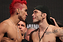 BELO HORIZONTE, BRAZIL - JUNE 22:   (L-R) Opponents Godofredo Pepey and Rony "Jason" Mariano Bezerra face off after making weight during the UFC 147 weigh in at Estadio Jornalista Felipe Drummond on June 22, 2012 in Belo Horizonte, Brazil.  (Photo by Josh Hedges/Zuffa LLC/Zuffa LLC via Getty Images)