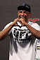 BELO HORIZONTE, BRAZIL - JUNE 22:   Sergio "Serginho" Moraes salutes the crowd before weighing in during the UFC 147 weigh in at Estadio Jornalista Felipe Drummond on June 22, 2012 in Belo Horizonte, Brazil.  (Photo by Josh Hedges/Zuffa LLC/Zuffa LLC via Getty Images)