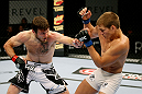 ATLANTIC CITY, NJ - JUNE 22: Dan Miller (L) throws a punch at Ricardo Funch (R) in a welterweight bout during UFC on FX 4 at Revel Casino on June 22, 2012 in Atlantic City, New Jersey.  (Photo by Nick Laham/Zuffa LLC/Zuffa LLC)