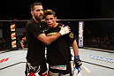 ATLANTIC CITY, NJ - JUNE 22:  Matt Brown (L) is congratulated on his win by TKO (knees and punches) by Luis Ramos (R) in a welterweight bout during UFC on FX 4 at Revel Casino on June 22, 2012 in Atlantic City, New Jersey.  (Photo by Nick Laham/Zuffa LLC/Zuffa LLC)