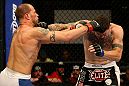 ATLANTIC CITY, NJ - JUNE 22:  Nick Catone (L) and Chris Camozzi (R) exchange punches in a middleweight bout during UFC on FX 4 at Revel Casino on June 22, 2012 in Atlantic City, New Jersey.  (Photo by Nick Laham/Zuffa LLC/Zuffa LLC)