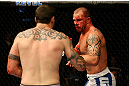 ATLANTIC CITY, NJ - JUNE 22:  Nick Catone (R) battles against Chris Camozzi (L) in a middleweight bout during UFC on FX 4 at Revel Casino on June 22, 2012 in Atlantic City, New Jersey.  (Photo by Nick Laham/Zuffa LLC/Zuffa LLC)
