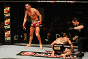 ATLANTIC CITY, NJ - JUNE 22:  Steven Siler (L) celebrates his win by submission guillotine choke as Joe Gambino (C) is tended to by referee Kevin Mulhall (R) in a featherweight bout during UFC on FX 4 at Revel Casino on June 22, 2012 in Atlantic City, New Jersey.  (Photo by Nick Laham/Zuffa LLC/Zuffa LLC)