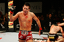 ATLANTIC CITY, NJ - JUNE 22:  Steven Siler (L) celebrates his win by submission guillotine choke as Joe Gambino (C) is tended to by referee Kevin Mulhall (R) in a featherweight bout during UFC on FX 4 at Revel Casino on June 22, 2012 in Atlantic City, New Jersey.  (Photo by Nick Laham/Zuffa LLC/Zuffa LLC)