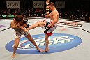 ATLANTIC CITY, NJ - JUNE 22: Rick Story (R) kicks Brock Jardine (L) in a welterweight bout during UFC on FX 4 at Revel Casino on June 22, 2012 in Atlantic City, New Jersey.  (Photo by Nick Laham/Zuffa LLC/Zuffa LLC)