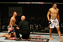 ATLANTIC CITY, NJ - JUNE 22:  Ramsey Nijem (R) celebrates his TKO win over C.J. Keith (L) who is tended to by referee Yves Lavigne (C) in a lightweight bout during UFC on FX 4 at Revel Casino on June 22, 2012 in Atlantic City, New Jersey.  (Photo by Nick Laham/Zuffa LLC/Zuffa LLC)