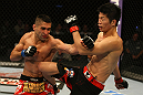 ATLANTIC CITY, NJ - JUNE 22:  Ricardo Lamas (L) punches Hatsu Hioki (R) who returns with a kick in a featherweight bout during UFC on FX 4 at Revel Casino on June 22, 2012 in Atlantic City, New Jersey.  (Photo by Nick Laham/Zuffa LLC/Zuffa LLC)