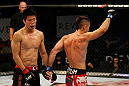ATLANTIC CITY, NJ - JUNE 22:  Hatsu Hioki (L) walks away as Ricardo Lamas (R) celebrates after the third round of their featherweight bout during UFC on FX 4 at Revel Casino on June 22, 2012 in Atlantic City, New Jersey.  (Photo by Nick Laham/Zuffa LLC/Zuffa LLC)