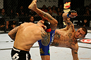 ATLANTIC CITY, NJ - JUNE 22:  Cub Swanson (R) kicks Ross Pearson (L) in a featherweight bout during UFC on FX 4 at Revel Casino on June 22, 2012 in Atlantic City, New Jersey.  (Photo by Nick Laham/Zuffa LLC/Zuffa LLC)