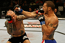ATLANTIC CITY, NJ - JUNE 22: Cub Swanson (R) exchanges punches with Ross Pearson (L) in a featherweight bout during UFC on FX 4 at Revel Casino on June 22, 2012 in Atlantic City, New Jersey. (Photo by Nick Laham/Zuffa LLC/Zuffa LLC)
