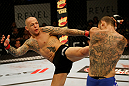 ATLANTIC CITY, NJ - JUNE 22:  Ross Pearson (L) kicks Cub Swanson (R) in a featherweight bout during UFC on FX 4 at Revel Casino on June 22, 2012 in Atlantic City, New Jersey.  (Photo by Nick Laham/Zuffa LLC/Zuffa LLC)