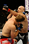 ATLANTIC CITY, NJ - JUNE 22:  Brian Ebersole (R) exchanges punches with T.J. Waldburger (L) in a welterweight bout during UFC on FX 4 at Revel Casino on June 22, 2012 in Atlantic City, New Jersey.  (Photo by Nick Laham/Zuffa LLC/Zuffa LLC)