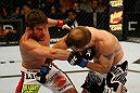 ATLANTIC CITY, NJ - JUNE 22: Sam Stout (L) punches Spencer Fisher (R) in a lightweight bout during UFC on FX 4 at Revel Casino on June 22, 2012 in Atlantic City, New Jersey. (Photo by Nick Laham/Zuffa LLC/Zuffa LLC)