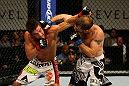 ATLANTIC CITY, NJ - JUNE 22: Sam Stout (L) exchanges punches with Spencer Fisher (R) in a lightweight bout during UFC on FX 4 at Revel Casino on June 22, 2012 in Atlantic City, New Jersey. (Photo by Nick Laham/Zuffa LLC/Zuffa LLC)