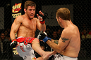 ATLANTIC CITY, NJ - JUNE 22: Sam Stout (L) kicks Spencer Fisher (R) in a lightweight bout during UFC on FX 4 at Revel Casino on June 22, 2012 in Atlantic City, New Jersey.  (Photo by Nick Laham/Zuffa LLC/Zuffa LLC)