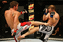 ATLANTIC CITY, NJ - JUNE 22: Sam Stout (L) exchanges kicks with Spencer Fisher (R) in a lightweight bout during UFC on FX 4 at Revel Casino on June 22, 2012 in Atlantic City, New Jersey. (Photo by Nick Laham/Zuffa LLC/Zuffa LLC)