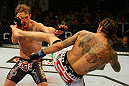 ATLANTIC CITY, NJ - JUNE 22:  Clay Guida (R) kicks Gray Maynard (L) in the main event lightweight bout during UFC on FX 4 at Revel Casino on June 22, 2012 in Atlantic City, New Jersey.  (Photo by Nick Laham/Zuffa LLC/Zuffa LLC)
