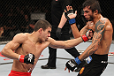 BELO HORIZONTE, BRAZIL - JUNE 23:   (L-R) Felipe Arantes delivers a punch to the body of Milton Vieira during their UFC 147 featherweight bout at Estadio Jornalista Felipe Drummond on June 23, 2012 in Belo Horizonte, Brazil.  (Photo by Josh Hedges/Zuffa LLC/Zuffa LLC via Getty Images)