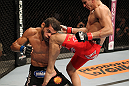 BELO HORIZONTE, BRAZIL - JUNE 23:   (R-L) Felipe Arantes lands a flying knee against Milton Vieira  during their UFC 147 featherweight bout at Estadio Jornalista Felipe Drummond on June 23, 2012 in Belo Horizonte, Brazil.  (Photo by Josh Hedges/Zuffa LLC/Zuffa LLC via Getty Images)