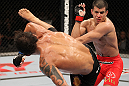 BELO HORIZONTE, BRAZIL - JUNE 23:   (L-R) Milton Vieira delivers a spinning kick to the head of Felipe Arantes  during their UFC 147 featherweight bout at Estadio Jornalista Felipe Drummond on June 23, 2012 in Belo Horizonte, Brazil.  (Photo by Josh Hedges/Zuffa LLC/Zuffa LLC via Getty Images)