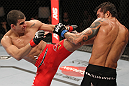 BELO HORIZONTE, BRAZIL - JUNE 23:   (L-R) Felipe Arantes lands a kick against Milton Vieira  during their UFC 147 featherweight bout at Estadio Jornalista Felipe Drummond on June 23, 2012 in Belo Horizonte, Brazil.  (Photo by Josh Hedges/Zuffa LLC/Zuffa LLC via Getty Images)