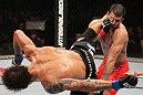 BELO HORIZONTE, BRAZIL - JUNE 23:   (L-R) Milton Vieira delivers a spinning kick to the head of Felipe Arantes  during their UFC 147 featherweight bout at Estadio Jornalista Felipe Drummond on June 23, 2012 in Belo Horizonte, Brazil.  (Photo by Josh Hedges/Zuffa LLC/Zuffa LLC via Getty Images)