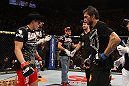 BELO HORIZONTE, BRAZIL - JUNE 23:   Felipe Arantes (L) and Milton Vieira (R) react after their UFC 147 featherweight bout is declared a draw at Estadio Jornalista Felipe Drummond on June 23, 2012 in Belo Horizonte, Brazil.  (Photo by Josh Hedges/Zuffa LLC/Zuffa LLC via Getty Images)