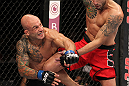 BELO HORIZONTE, BRAZIL - JUNE 23:   (L-R) Wagner "Galeto" Campos punches Marcos Vinicius "Vina" during their UFC 147 featherweight bout at Estadio Jornalista Felipe Drummond on June 23, 2012 in Belo Horizonte, Brazil.  (Photo by Josh Hedges/Zuffa LLC/Zuffa LLC via Getty Images)