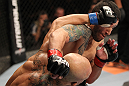 BELO HORIZONTE, BRAZIL - JUNE 23:   (L-R) Wagner "Galeto" Campos and Marcos Vinicius "Vina" exchange punches  during their UFC 147 featherweight bout at Estadio Jornalista Felipe Drummond on June 23, 2012 in Belo Horizonte, Brazil.  (Photo by Josh Hedges/Zuffa LLC/Zuffa LLC via Getty Images)