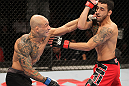 BELO HORIZONTE, BRAZIL - JUNE 23:   (L-R) Wagner "Galeto" Campos punches Marcos Vinicius "Vina" during their UFC 147 featherweight bout at Estadio Jornalista Felipe Drummond on June 23, 2012 in Belo Horizonte, Brazil.  (Photo by Josh Hedges/Zuffa LLC/Zuffa LLC via Getty Images)