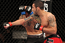 BELO HORIZONTE, BRAZIL - JUNE 23:   (R-L) Marcos Vinicius "Vina" punches Wagner "Galeto" Campos  during their UFC 147 featherweight bout at Estadio Jornalista Felipe Drummond on June 23, 2012 in Belo Horizonte, Brazil.  (Photo by Josh Hedges/Zuffa LLC/Zuffa LLC via Getty Images)