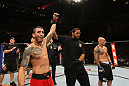 BELO HORIZONTE, BRAZIL - JUNE 23:   Marcos Vinicius "Vina" (L) reacts after knocking out Wagner "Galeto" Campos (R)  during their UFC 147 featherweight bout at Estadio Jornalista Felipe Drummond on June 23, 2012 in Belo Horizonte, Brazil.  (Photo by Josh Hedges/Zuffa LLC/Zuffa LLC via Getty Images)