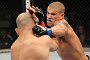 BELO HORIZONTE, BRAZIL - JUNE 23:   (R-L) Leonardo Mafra punches Thiago Perpetuo during their UFC 147 middleweight bout at Estadio Jornalista Felipe Drummond on June 23, 2012 in Belo Horizonte, Brazil.  (Photo by Josh Hedges/Zuffa LLC/Zuffa LLC via Getty Images)