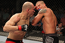 BELO HORIZONTE, BRAZIL - JUNE 23:   (L-R) Thiago "Bodao" Perpetuo punches Leonardo Mafra during their UFC 147 middleweight bout at Estadio Jornalista Felipe Drummond on June 23, 2012 in Belo Horizonte, Brazil.  (Photo by Josh Hedges/Zuffa LLC/Zuffa LLC via Getty Images)