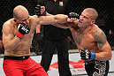 BELO HORIZONTE, BRAZIL - JUNE 23:   (R-L) Leonardo Mafra and Thiago "Bodao" Perpetuo exchange punches during their UFC 147 middleweight bout at Estadio Jornalista Felipe Drummond on June 23, 2012 in Belo Horizonte, Brazil.  (Photo by Josh Hedges/Zuffa LLC/Zuffa LLC via Getty Images)