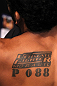 BELO HORIZONTE, BRAZIL - JUNE 23:   A tattoo is seen on the back of Hugo "Wolverine" Viana before his UFC 147 featherweight bout against John Teixeira at Estadio Jornalista Felipe Drummond on June 23, 2012 in Belo Horizonte, Brazil.  (Photo by Josh Hedges/Zuffa LLC/Zuffa LLC via Getty Images)