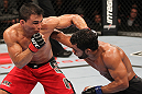 BELO HORIZONTE, BRAZIL - JUNE 23:   (L-R) John Teixeira and Hugo "Wolverine" Viana trade punches during their UFC 147 featherweight bout at Estadio Jornalista Felipe Drummond on June 23, 2012 in Belo Horizonte, Brazil.  (Photo by Josh Hedges/Zuffa LLC/Zuffa LLC via Getty Images)