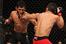 BELO HORIZONTE, BRAZIL - JUNE 23:   (R-L) John Teixeira punches Hugo "Wolverine" Viana during their UFC 147 featherweight bout at Estadio Jornalista Felipe Drummond on June 23, 2012 in Belo Horizonte, Brazil.  (Photo by Josh Hedges/Zuffa LLC/Zuffa LLC via Getty Images)