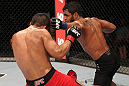 BELO HORIZONTE, BRAZIL - JUNE 23:   (R-L) Hugo "Wolverine" Viana punches John Teixeira during their UFC 147 featherweight bout at Estadio Jornalista Felipe Drummond on June 23, 2012 in Belo Horizonte, Brazil.  (Photo by Josh Hedges/Zuffa LLC/Zuffa LLC via Getty Images)
